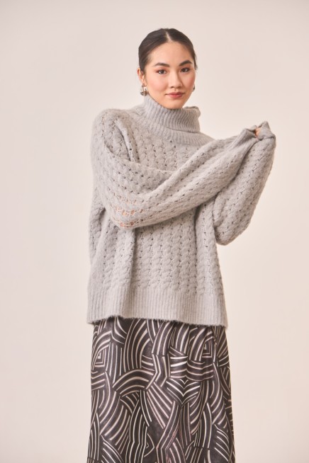 JERSEY OVERSIZE CON CUELLO ALTO Y MANGA GLOBO
